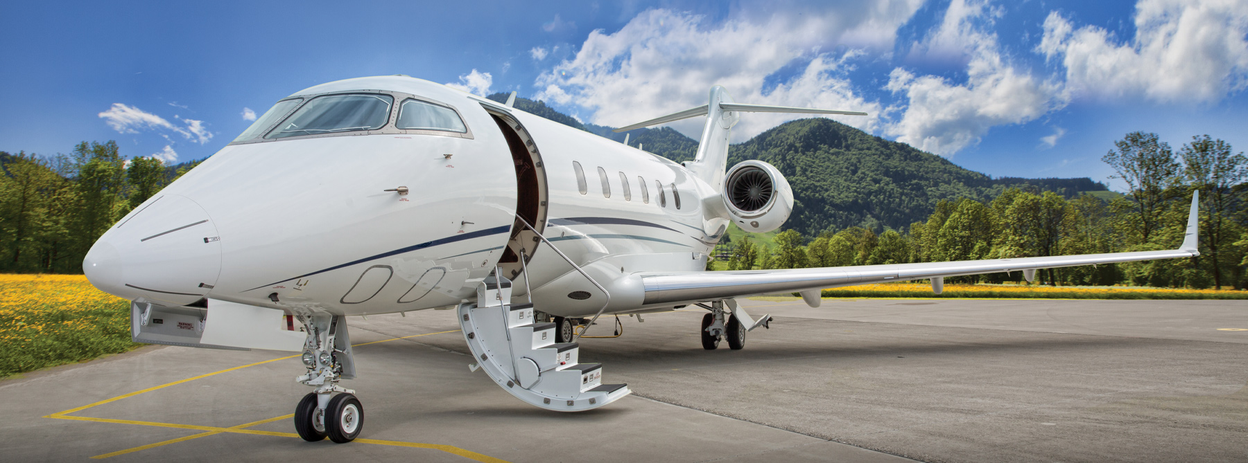 An private jet sitting on a runway with the stairs down